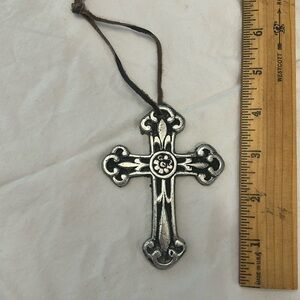 Metal cross with leather tie